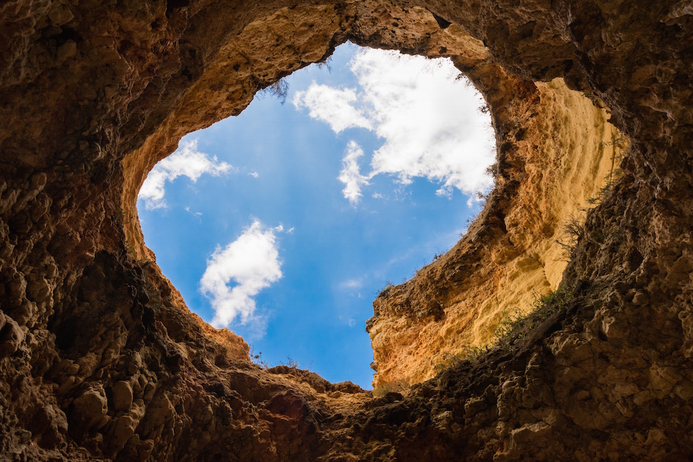 Blue Cloud sky in cave hole landscape.
